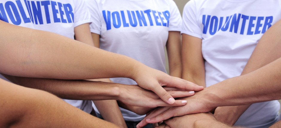 Volunteer group hands together
